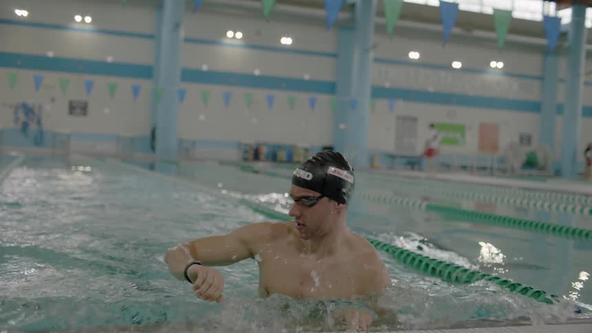 Man swims in an indoor pool