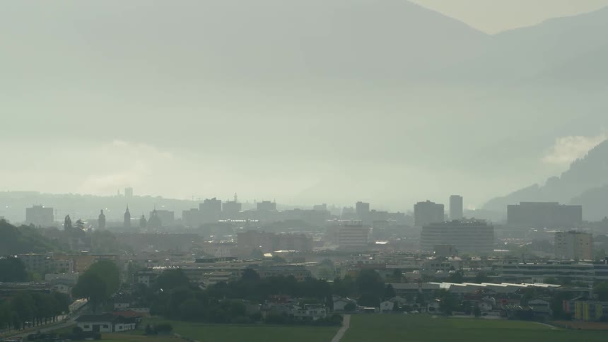 The city of Innsbruck is covered with thick fog