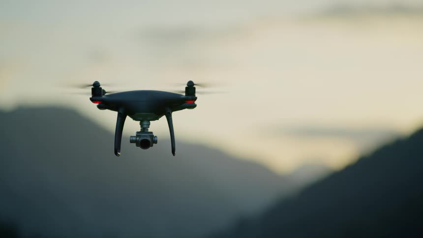 A drone is flying in the air and being filmed