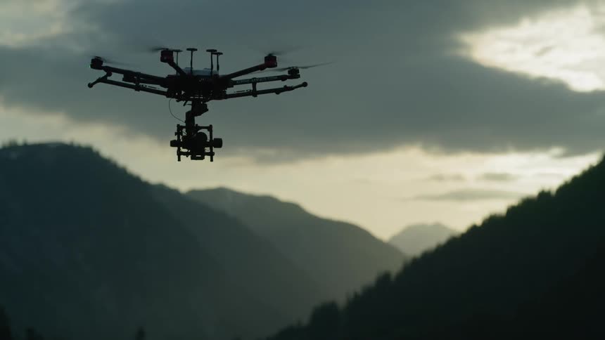 A large drone is hovering in the air