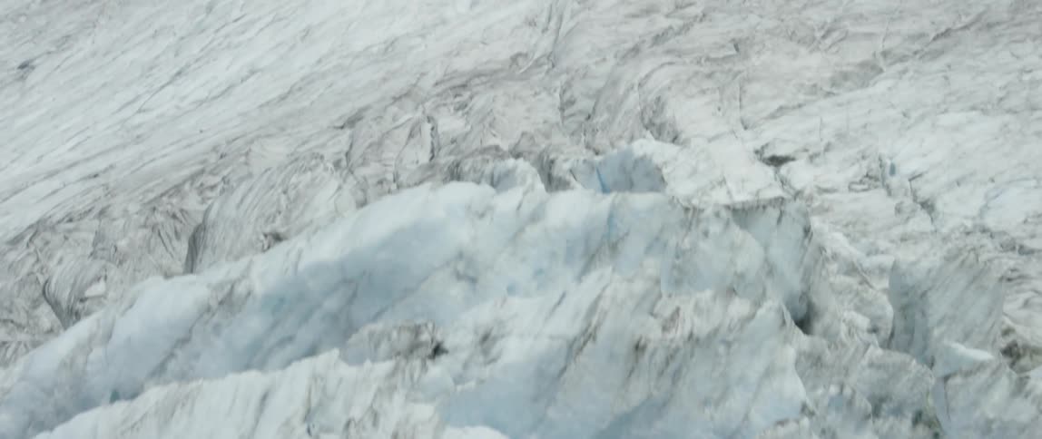 Piles of snow sit in mountains