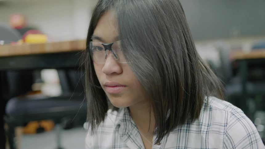 Student wears safety glasses in a workshop