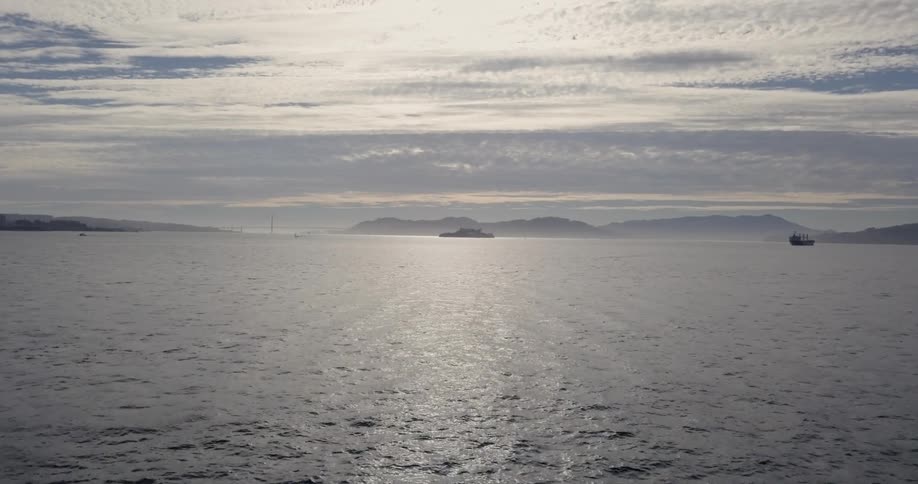 Rippling ocean water in bay on cloudy evening