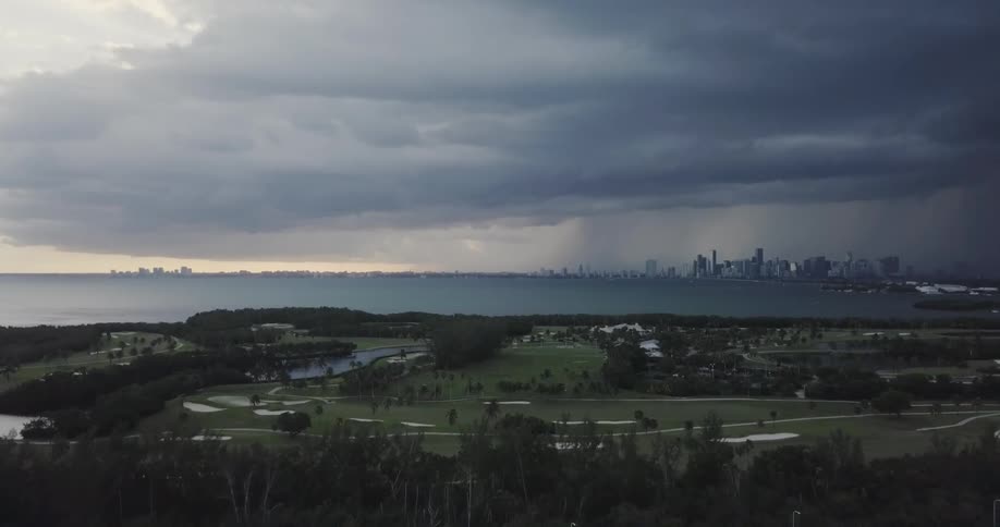 Storm clouds float over a golf course