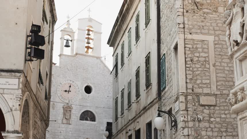 Bells ring on an old stone church