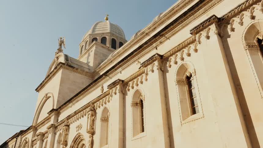 An old church is filmed from street level