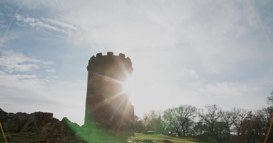 Clouds pass over a tower