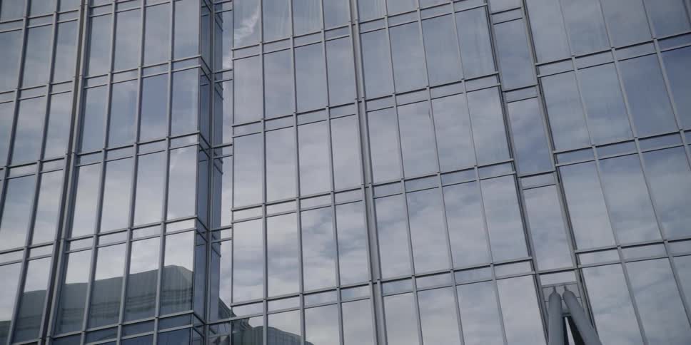 Reflection of clouds on a large building