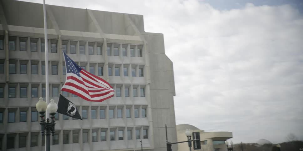 The flag is flying on the side of the building