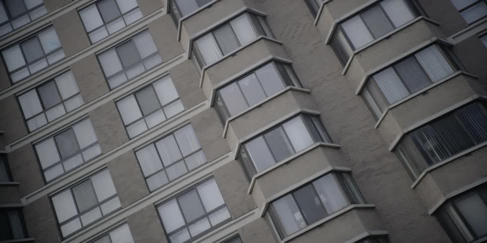 The building is tall with many levels