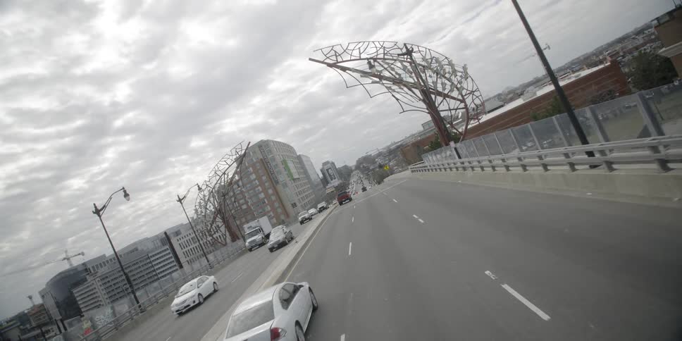 Many cars travel over this bridge on a cloudy day
