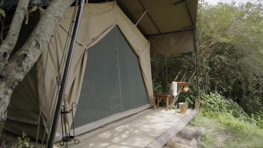The canvas is pulled back on a house tent with a porch