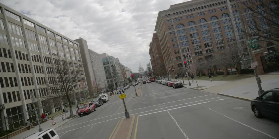 Parked cars line a city street