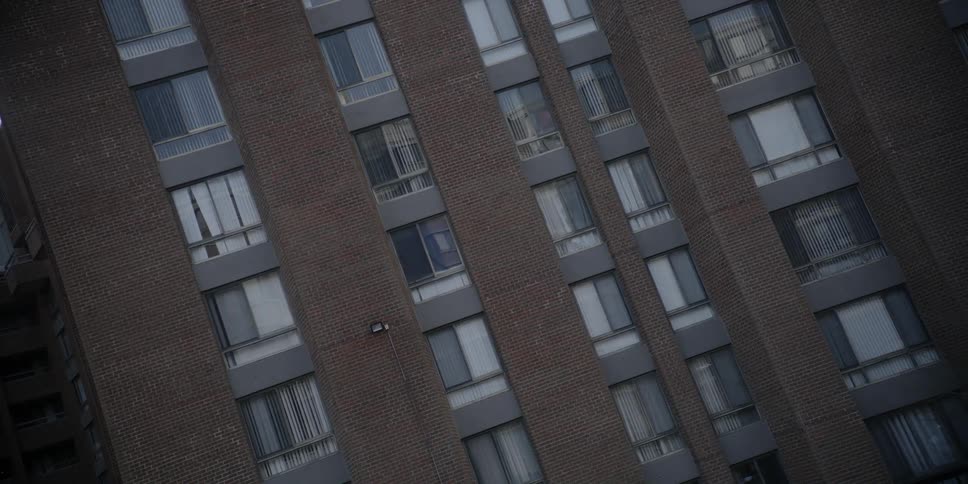 A brick building stands in a city