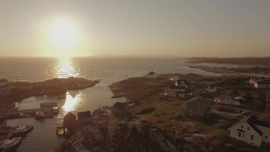 The sun shines on a coastal village