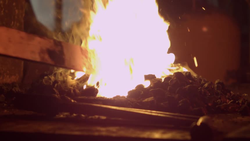 A fire burns at night