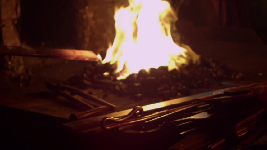 A hot piece of metal is placed in a fire