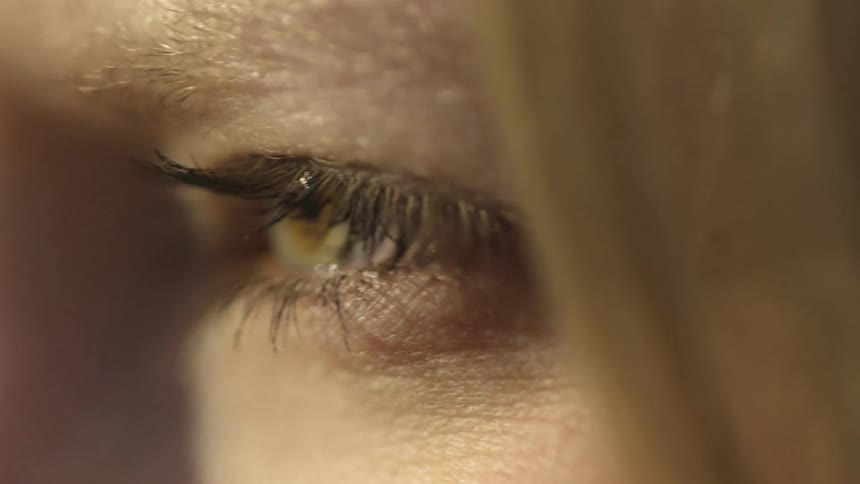 A woman stares out on a sunny day