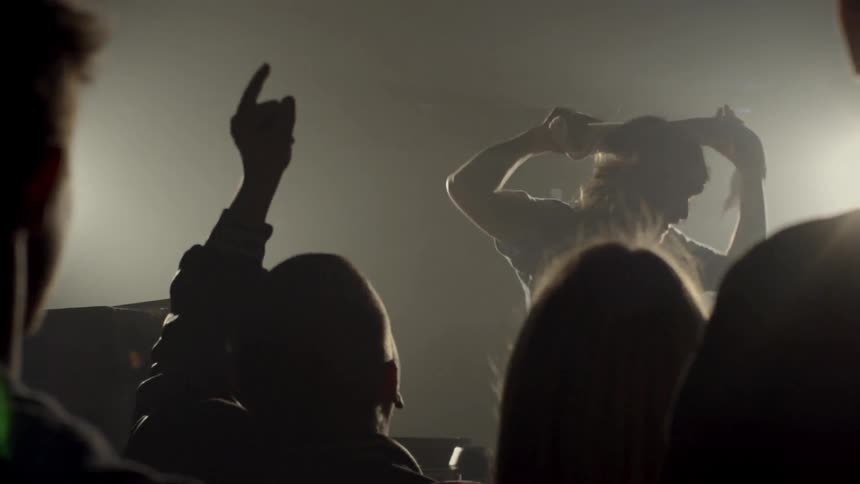A musician hypes up the crowd
