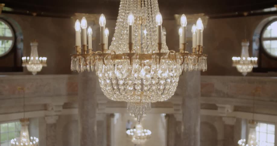 A chandelier hangs in a rotunda