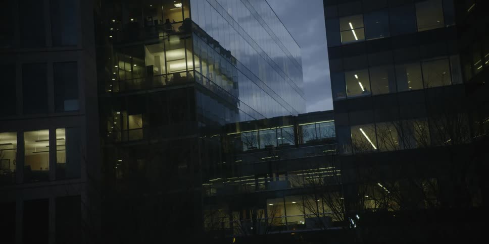 The building floors are lit at dawn