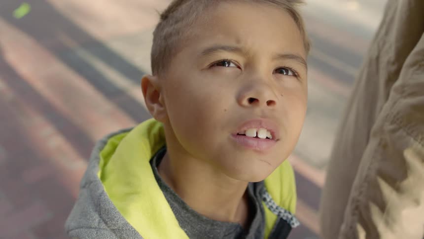 Boy looks up towards the sky