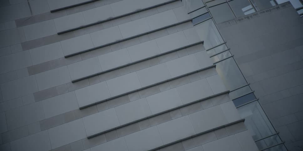 The outside wall of a building is viewed