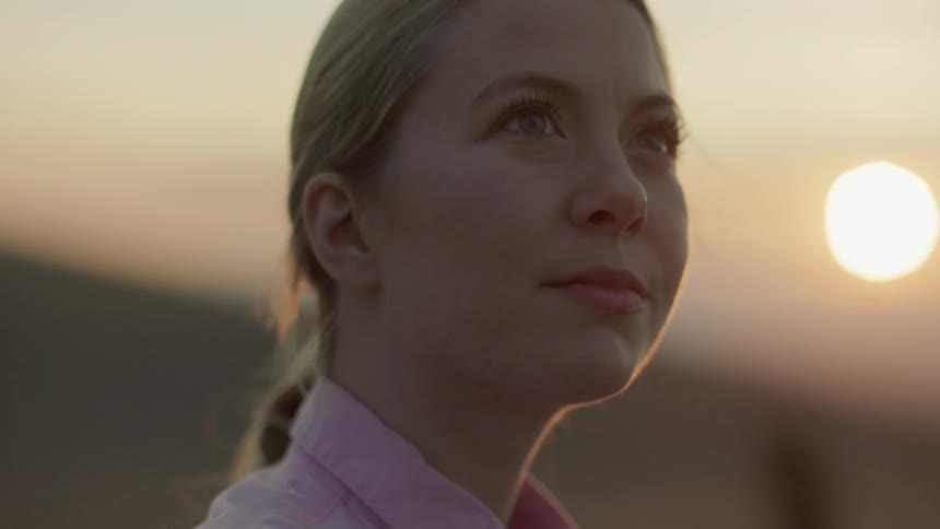 A woman is looking with a content look on her face