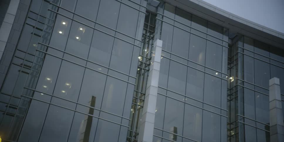 Building with large glass windows and lights inside