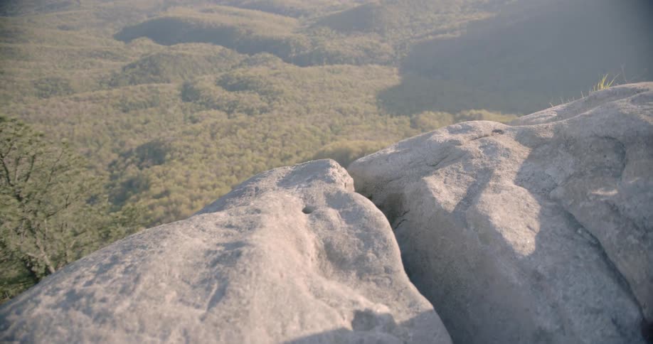The high mountain has clouds at the top