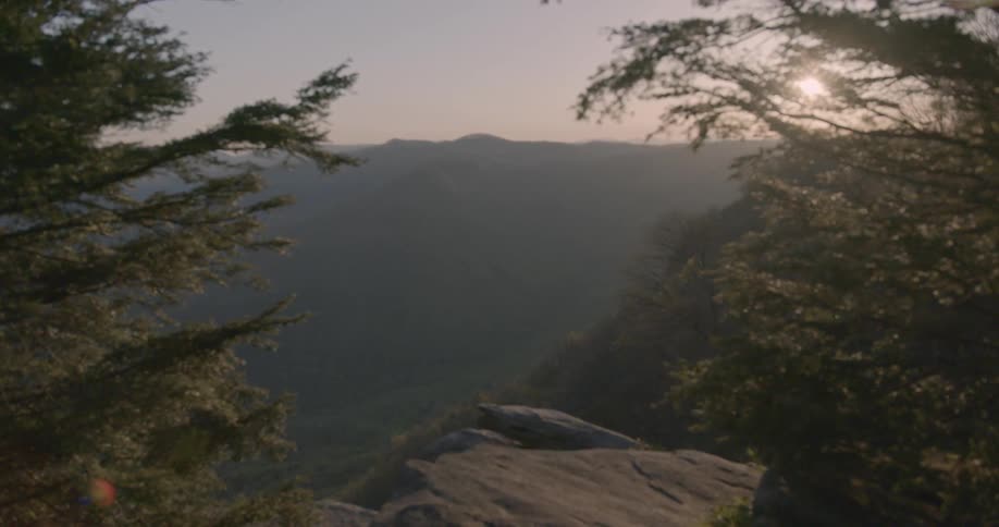 The mountain range has fog hovering over it