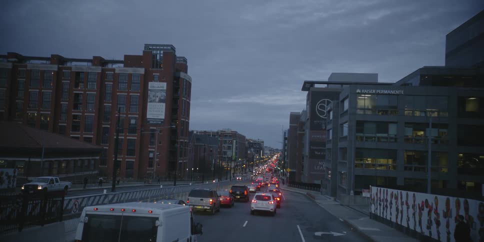 A traffic jam is happening on a busy city street