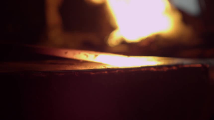 Anvil striking a piece of hot metal