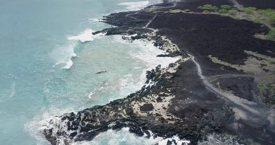Waves flow onto the rocky shore