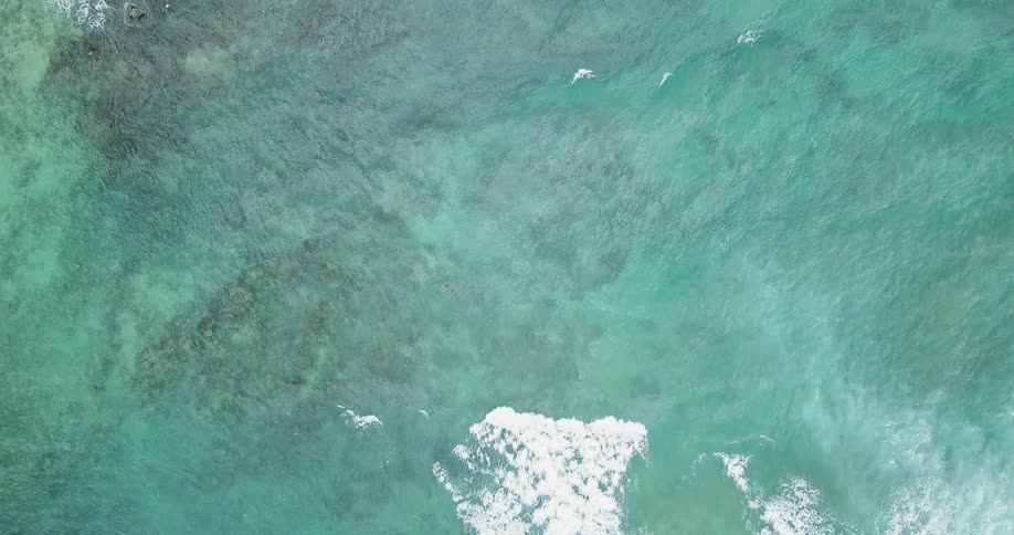 The water is blue with some waves and is clear