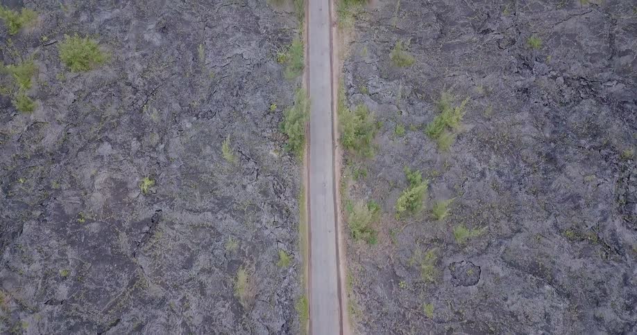 Straight road stretching through a flat area as seen from above