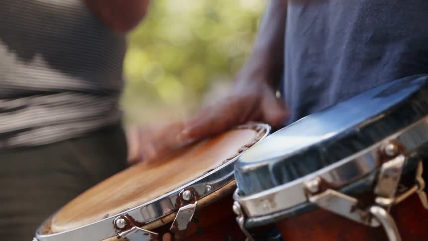 A man plays a pair of drums