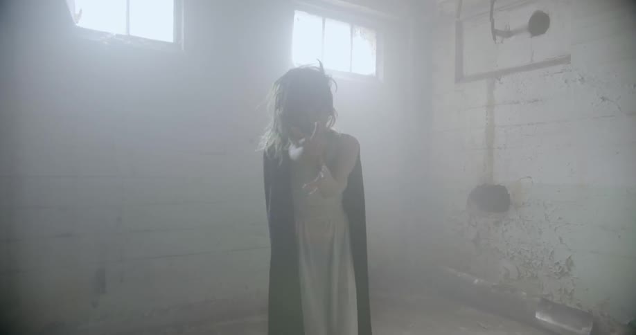 Woman dances in an empty warehouse