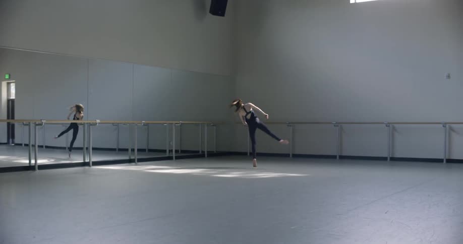 A woman dances in a studio