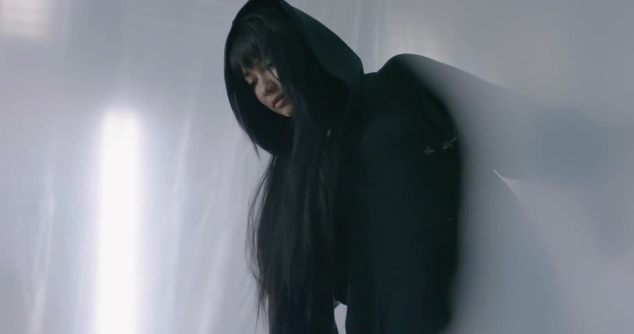 Woman in a room with a hazy glow all around her