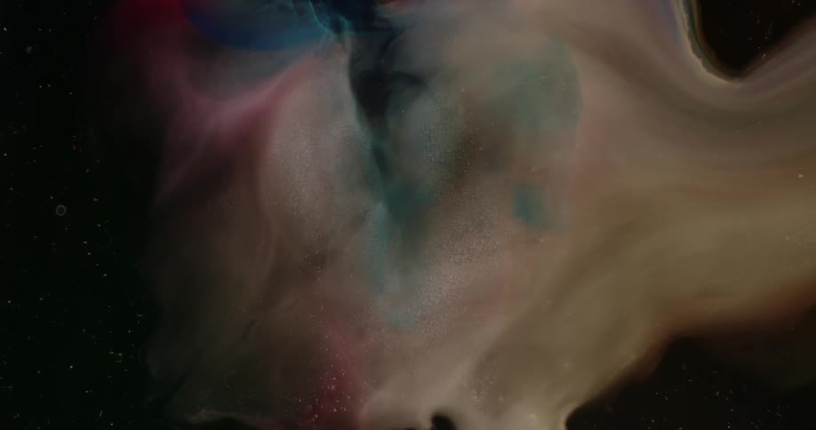 Abstract of different colors of smoke swirling together