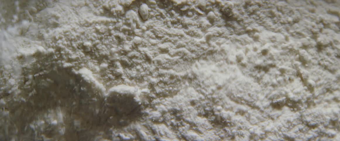 Sand granules vibrate and break apart