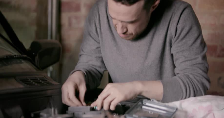 A man is working on a car