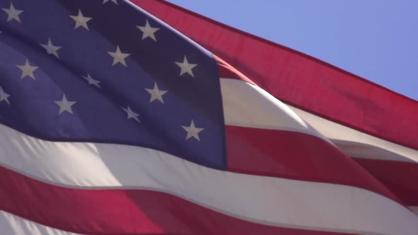 An american flag billows in the wind