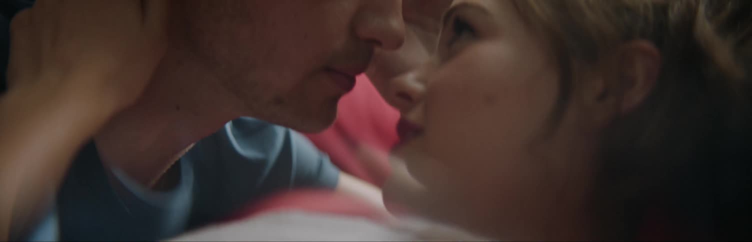 Couple kissing each other and smiling