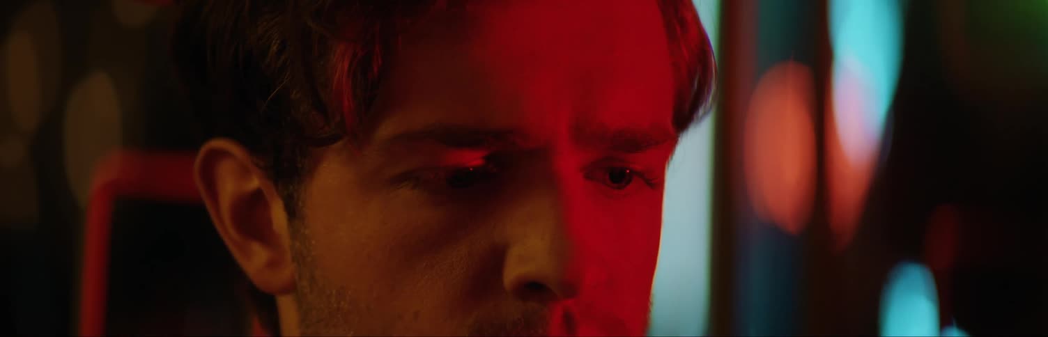 Man standing in room staring off in the distance