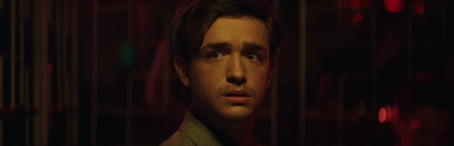 Man in club staring at something
