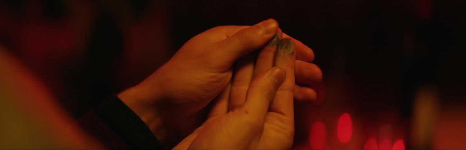 Woman rubs ink on her fingertips