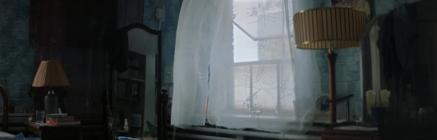 Window of bedroom is open and wind is blowing curtain