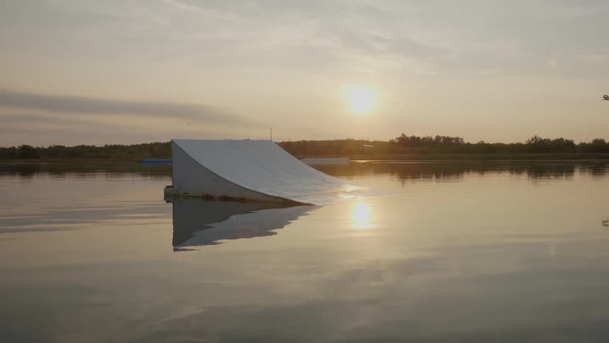 A ramp sits in the water on a cloudy day